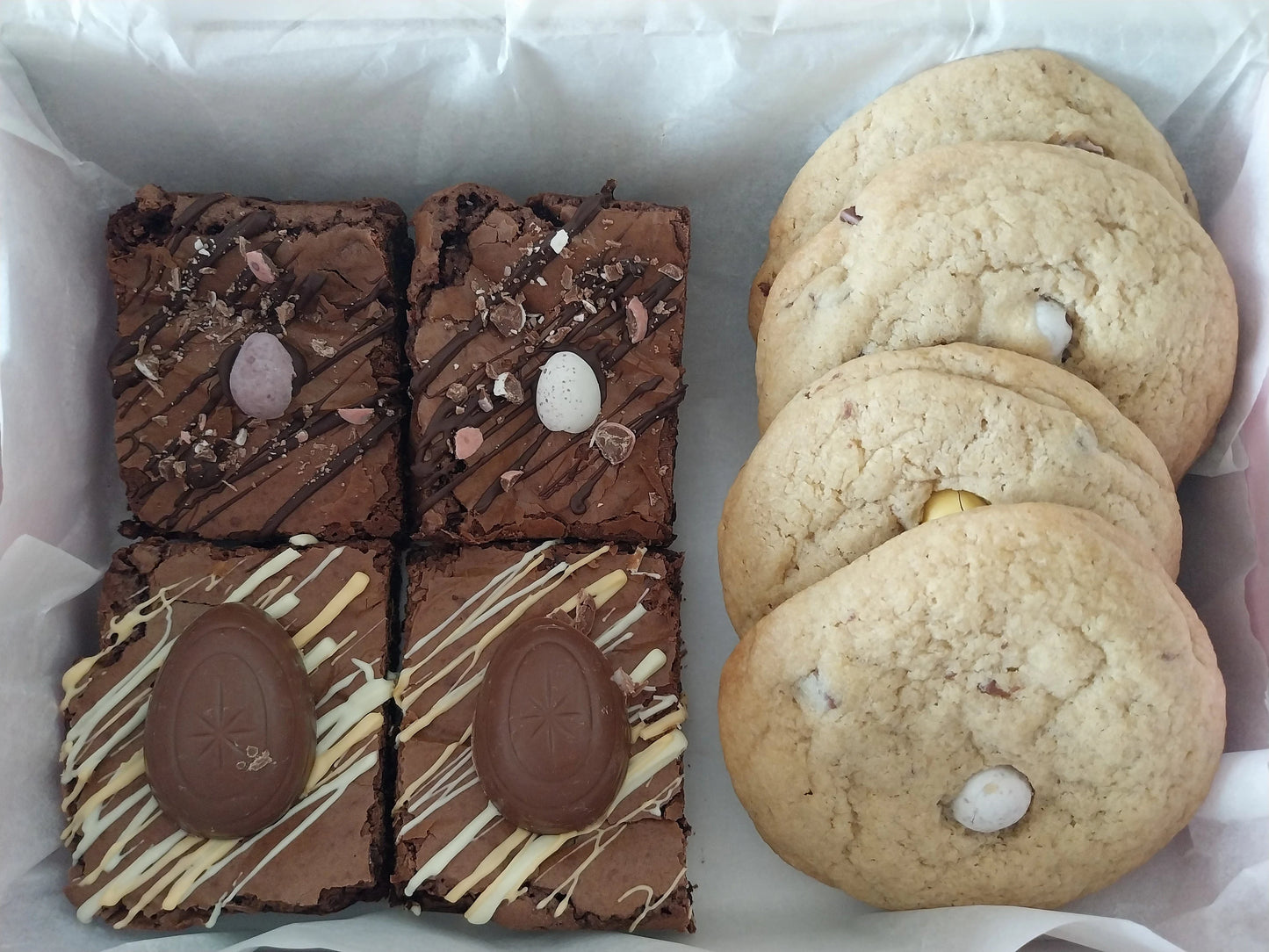A box of 2 creme egg brownies, 2 mini egg brownies and 4 large mini egg cookies