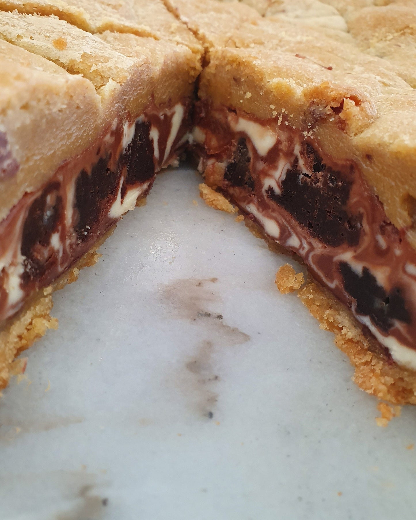 Whole chocolate cookie pie with a slice removed