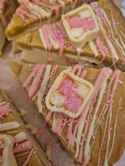 Close up of a battenerg cookie pie slice