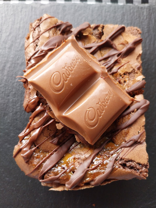 Close up image of a chocolate caramel topped with Cadbury Caramel pieces