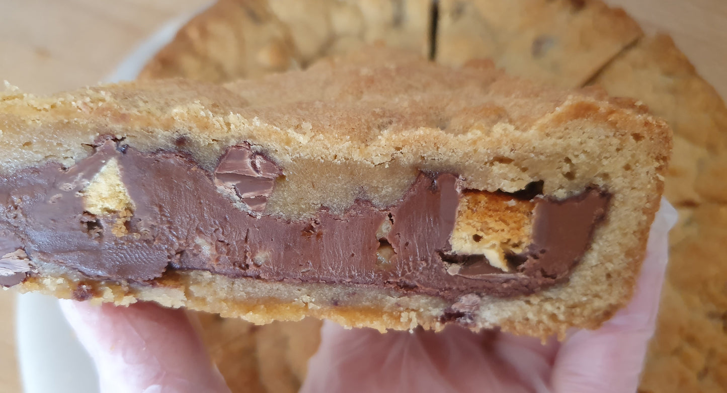 Holding up a slice of Crunchie chocolate cookie pie