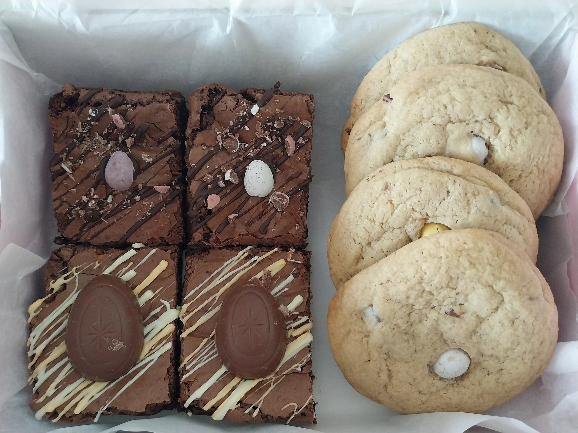 A box of 2 creme egg brownies, 2 mini egg brownies and 4 large mini egg cookies
