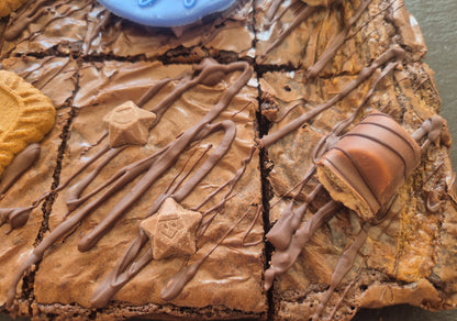 Brownies with chocolate drizzle and Magic Stars and Kinder Bueno
