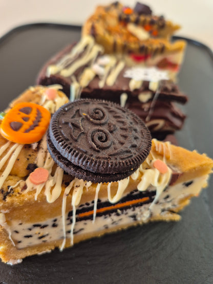 Four Halloween-themed cookie pies on a dark surface