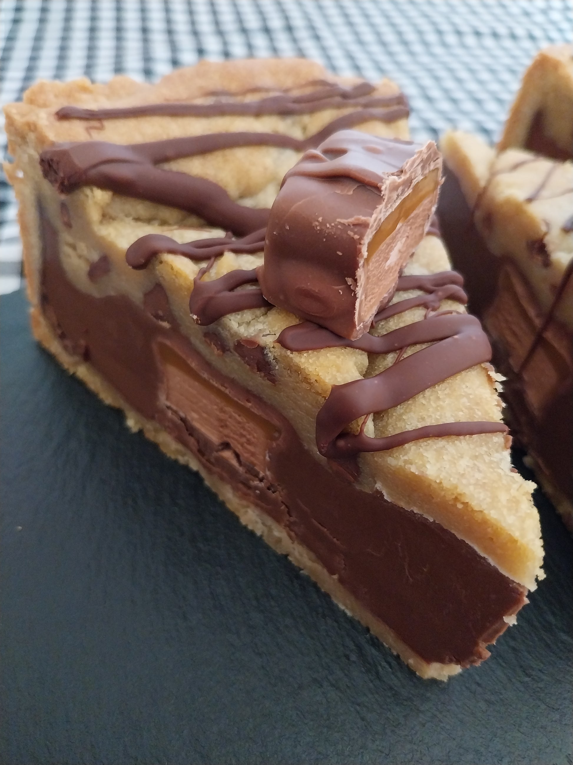 Close up of a slice of Mars Bar cookie pie