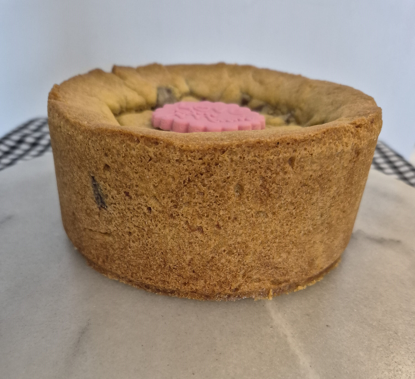 Side view of cookie pie on a grey surface
