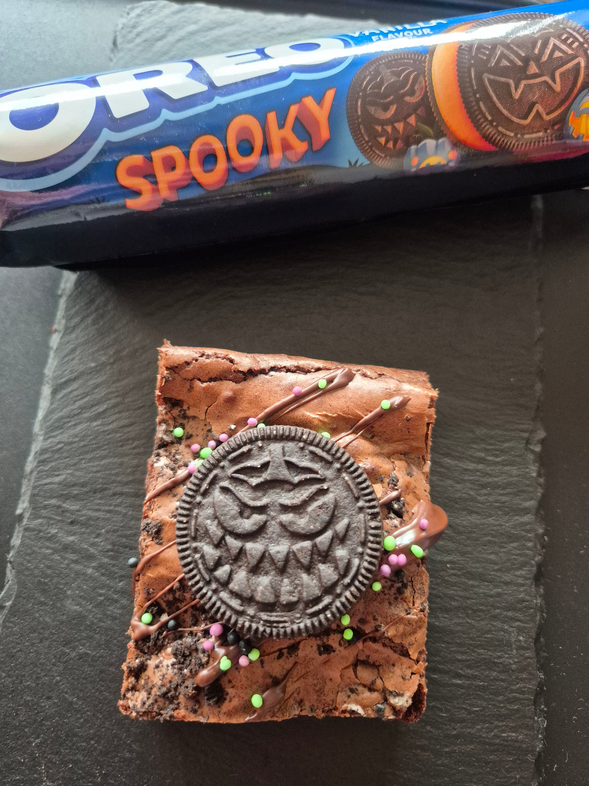 An oreo brownie with a packet of Spooky Oreos visible
