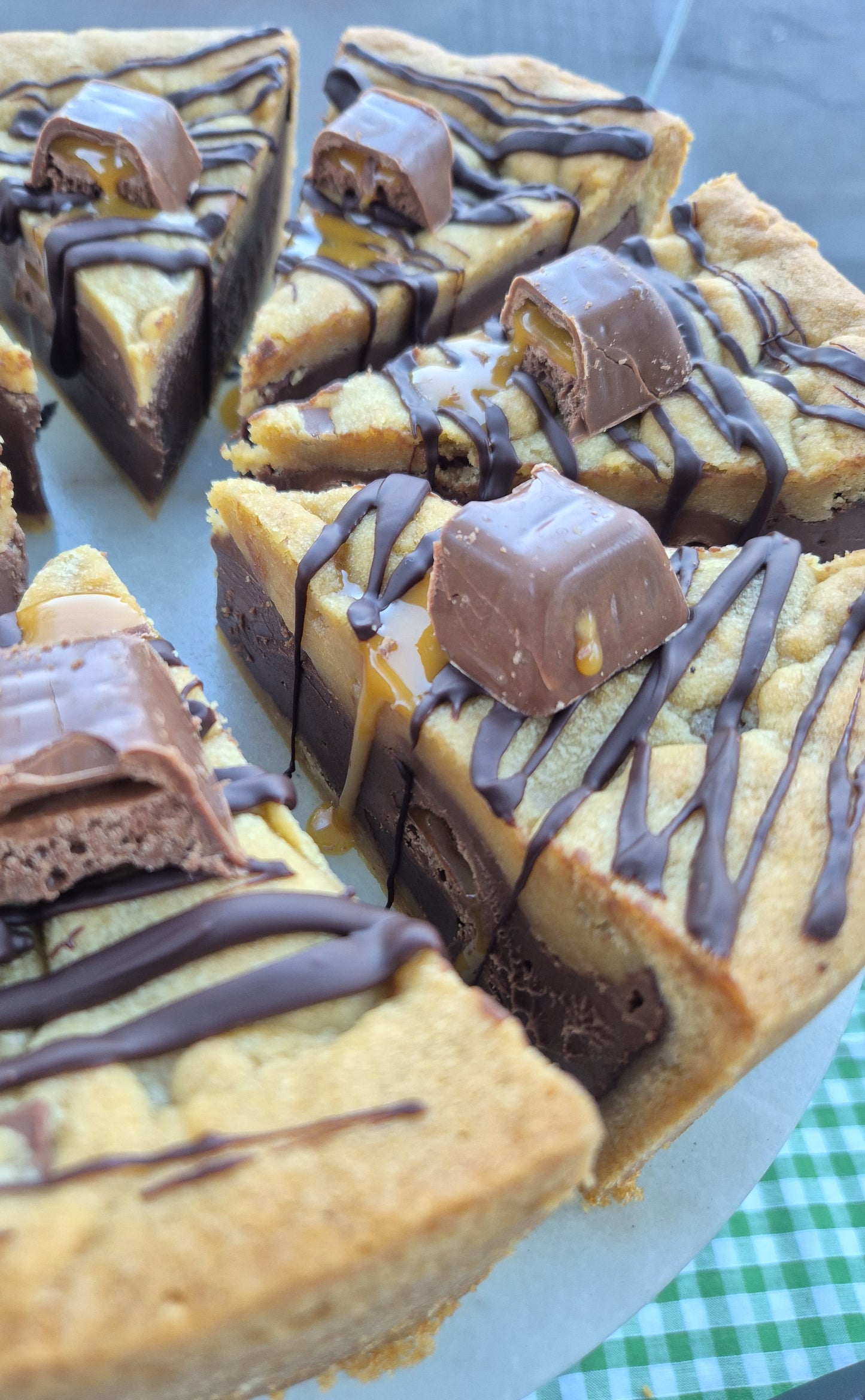 Slices of Wispa Gold cookie pie on a cake stand