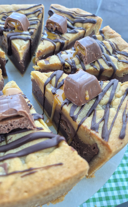 Slices of Wispa Gold cookie pie on a cake stand